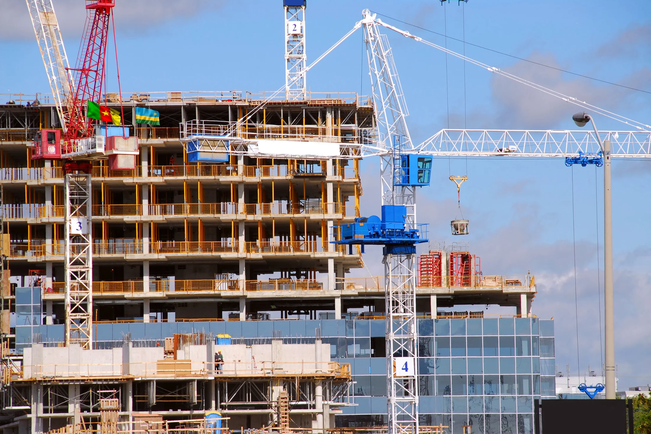 INFRACONS high-rise construction site with tower cranes
